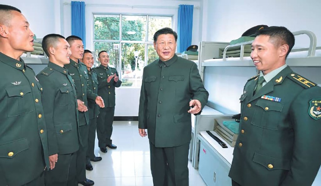 Chinese military soldiers standing in room smiling