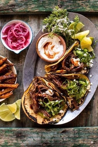 Crockpot Carne Asada Tacos with Cilantro Lime Garlic Sauce | halfbakedharvest.com