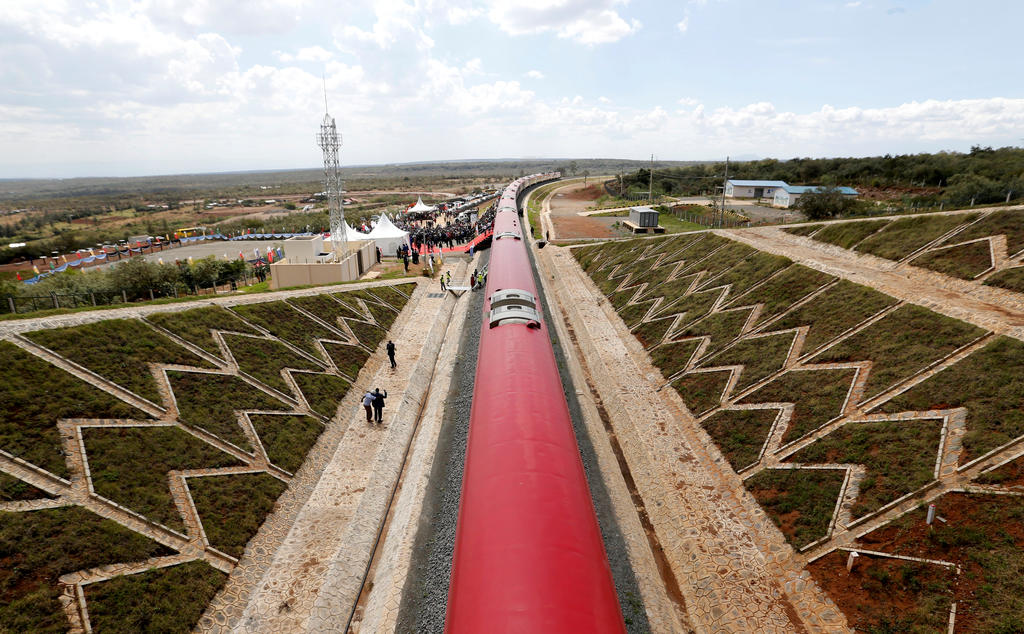 An aerial view shows a train on the Standard Gauge Railway (SGR) line constructed by the China Road and Bridge Corporation (CRBC) and financed by Chinese government in Kimuka, Kenya October 16, 2019. REUTERS/Thomas Mukoya/File Photo