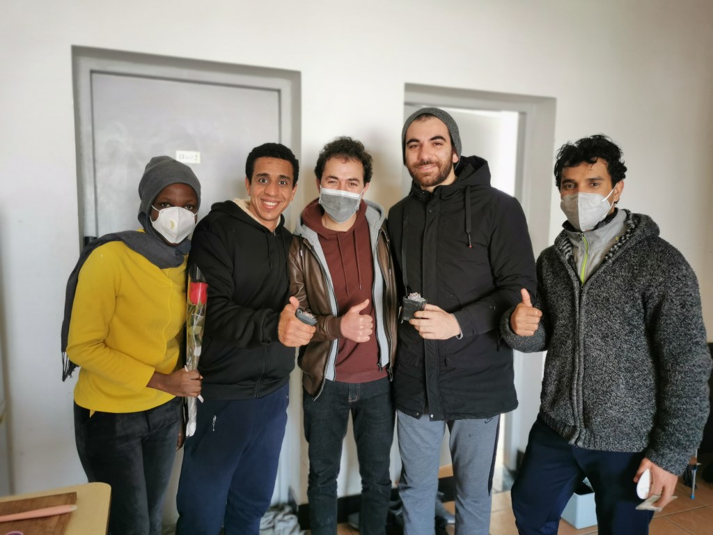 Group of students smiling with mask on face